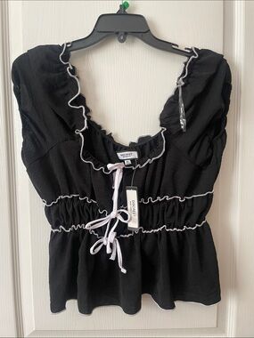 Discreet Black Peplum Ruffle Tie-Front Blouse with White Trim